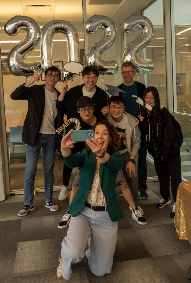 Vantage One Science Professors, Jodie Martin and Georg Rieger, taking a selfie with graduating Vantage alumni (photo: Kirc Cohen)