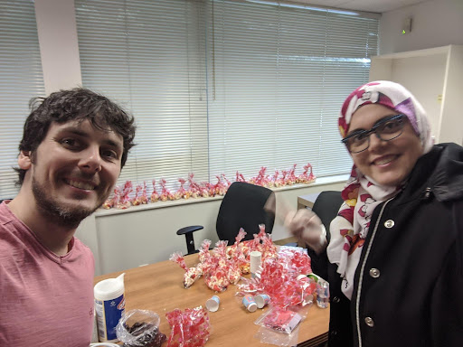 UBC St John's College students distributing candy to residents doors during lockdown in March